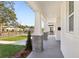 Inviting front porch with decorative columns and a paved walkway at 2308 Depauw Ave, Orlando, FL 32804