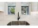 Modern kitchen sink with stainless steel fixtures and bright natural light at 2308 Depauw Ave, Orlando, FL 32804