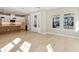 Spacious living room featuring light wood floors, recessed lighting, and views to the kitchen at 2308 Depauw Ave, Orlando, FL 32804