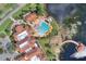 Gorgeous aerial view of the community center, swimming pool, and boardwalk along the scenic lake at 439 Toldedo Rd, Davenport, FL 33837