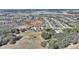 Wide aerial shot showing the property's location, with surrounding trees and the broader community at 439 Toldedo Rd, Davenport, FL 33837