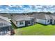 Aerial view of the property displaying the backyard, screened lanai, and lush green surroundings at 439 Toldedo Rd, Davenport, FL 33837