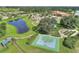 Lush, green common area, including a basketball court, playground, and walking trail around a pond at 439 Toldedo Rd, Davenport, FL 33837