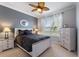 Calming bedroom featuring a ceiling fan, neutral walls, and an abundant window at 439 Toldedo Rd, Davenport, FL 33837