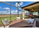 Relaxing screened patio with comfortable seating, offering beautiful outdoor views at 439 Toldedo Rd, Davenport, FL 33837