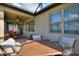 Cozy covered patio with a table, chairs, and a ceiling fan, perfect for outdoor relaxation at 439 Toldedo Rd, Davenport, FL 33837