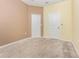 Spacious bedroom with carpeted floors, closet and neutral paint, offering a calm and inviting space at 1006 Breggia Ct, Haines City, FL 33844