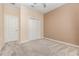 Bedroom featuring neutral walls and carpet, plus closet and neutral paint, offering a calm space at 1006 Breggia Ct, Haines City, FL 33844