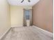 Cozy bedroom featuring neutral tones, carpeted floors, and a window with natural light at 1006 Breggia Ct, Haines City, FL 33844