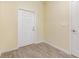 Welcoming entryway with wood-look tile floors, and a white front door at 1006 Breggia Ct, Haines City, FL 33844