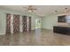 Living room with tile floors, lots of windows, ceiling fan and bar seating at 1006 Breggia Ct, Haines City, FL 33844