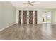 An open living room with tile floors, neutral walls, ceiling fan and sliding doors at 1006 Breggia Ct, Haines City, FL 33844