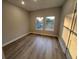 Bright bedroom with wood floors and ample natural light at 1632 Haven Dr, Orlando, FL 32803