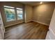 Bright bedroom with hardwood floors, natural light, and neutral walls, creating a serene and inviting atmosphere at 1632 Haven Dr, Orlando, FL 32803