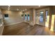 Light-filled living room featuring wood floors and a glass patio door at 1632 Haven Dr, Orlando, FL 32803