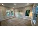 Spacious main bedroom featuring hardwood floors, large windows and a glass enclosed shower at 1632 Haven Dr, Orlando, FL 32803