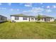 Expansive backyard showcasing well-maintained lawn, offering a perfect outdoor space for recreation and relaxation at 1671 Ruby Ln, Lake Alfred, FL 33850