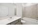 Stylish bathroom with a sleek vanity, modern fixtures, and tiled tub-shower, offering a serene and functional space at 1671 Ruby Ln, Lake Alfred, FL 33850