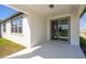Covered patio area with sliding glass doors, seamlessly blending indoor and outdoor living for relaxation at 1671 Ruby Ln, Lake Alfred, FL 33850