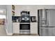 Kitchen featuring stainless steel oven, microwave and fridge at 2410 Berkshire Ct, Kissimmee, FL 34746