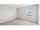Neutral-toned bedroom with a window and carpeted floors at 288 Woodsage Pl, Lake Alfred, FL 33850