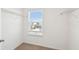 Walk-in closet with window, shelving and carpeted floor at 288 Woodsage Pl, Lake Alfred, FL 33850