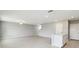 Open-concept living space features white tile flooring at 288 Woodsage Pl, Lake Alfred, FL 33850