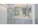 Bathroom with a glass enclosed shower and double sinks at 346 Wayland Dr, Haines City, FL 33844