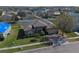 Aerial view of a beautiful home with a well-manicured lawn and a paved driveway at 3890 Wood Thrush Dr, Kissimmee, FL 34744