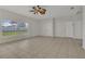 Large bedroom with tile floors and a ceiling fan for added comfort at 3890 Wood Thrush Dr, Kissimmee, FL 34744