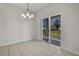 Bright dining area with sliding glass doors opening to the backyard patio at 3890 Wood Thrush Dr, Kissimmee, FL 34744