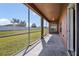 Screened lanai overlooking backyard at 3890 Wood Thrush Dr, Kissimmee, FL 34744