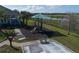 Community playground featuring a covered play structure and a bocce ball court at 3890 Wood Thrush Dr, Kissimmee, FL 34744