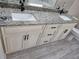 Double vanity in bathroom with granite countertop, modern sinks, and designer cabinets at 1260 Buckeye Ne Rd, Winter Haven, FL 33881