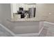 Open concept kitchen with granite countertops, stainless appliances, and barstool seating at 1260 Buckeye Ne Rd, Winter Haven, FL 33881