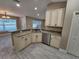 Well-lit kitchen with stainless steel appliances, granite countertops, and modern cabinetry at 1260 Buckeye Ne Rd, Winter Haven, FL 33881
