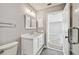 Neutral bathroom featuring a modern vanity, framed mirror, and open access to the bedroom at 1353 Lajolla Cir, The Villages, FL 32159