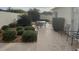 Private patio area with lush landscaping, seating, and hardscaping makes for excellent outdoor living at 1353 Lajolla Cir, The Villages, FL 32159