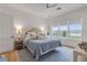 Serene bedroom with a large window offering water views and a cozy rug at 472 Desoto Dr, New Smyrna Beach, FL 32169