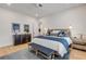 Primary bedroom with modern decor, furnishings, and beautiful wood flooring at 472 Desoto Dr, New Smyrna Beach, FL 32169