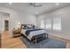 Comfortable main bedroom with a ceiling fan, bright windows and decorative rug at 472 Desoto Dr, New Smyrna Beach, FL 32169