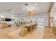Elegant dining area with seating for ten, views, and seamless access to both the living room and backyard at 472 Desoto Dr, New Smyrna Beach, FL 32169