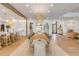 Spacious dining area featuring seating for many, an open kitchen, and modern lighting at 472 Desoto Dr, New Smyrna Beach, FL 32169