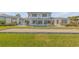 This gorgeous home boasts a pool, lush lawn, and a bocce ball court for outdoor fun at 472 Desoto Dr, New Smyrna Beach, FL 32169