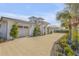 Modern home with a three-car garage and attractive landscaping for a refined curb appeal at 472 Desoto Dr, New Smyrna Beach, FL 32169