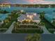 Stunning waterfront home with lush landscaping, driveway, and three-car garage at 472 Desoto Dr, New Smyrna Beach, FL 32169