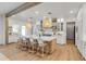 Bright, modern kitchen featuring a large island, custom cabinetry, and pendant lighting at 472 Desoto Dr, New Smyrna Beach, FL 32169