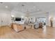 Open-concept living area with modern finishes, a large sectional, and seamless access to outdoor spaces at 472 Desoto Dr, New Smyrna Beach, FL 32169