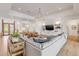 Spacious living room with ample seating, modern lighting, and open floorplan at 472 Desoto Dr, New Smyrna Beach, FL 32169
