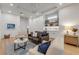 A comfy living room with a wet bar, sofa, chairs and a decorative rug at 472 Desoto Dr, New Smyrna Beach, FL 32169